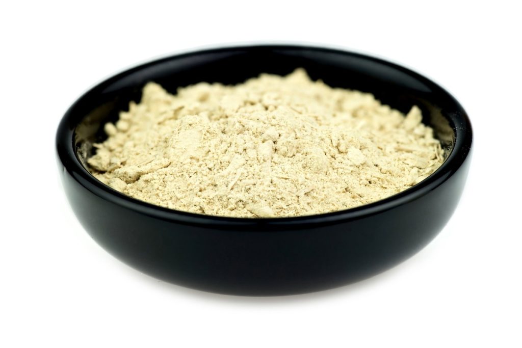 A small bowl of powdered kava plant extract